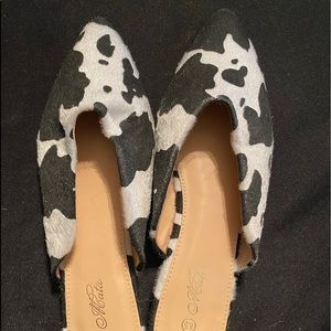 Dressed in Lala Cowprint mules/flats